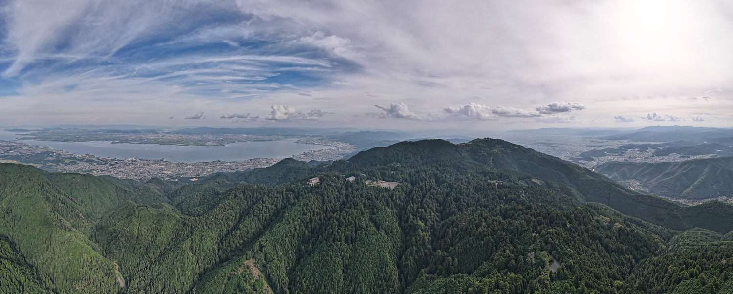 Panoramic drone view of Mount Hiei from the northeast, with the city of Ōtsu visible to the left.